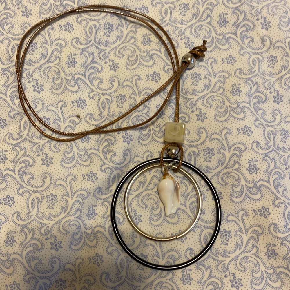 Very cool handmade necklace with beads, stone and seashell.
